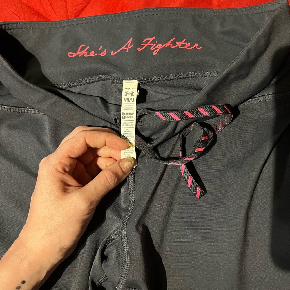 Under Armour charcoal gray and pink yoga Capri pants. Size medium.